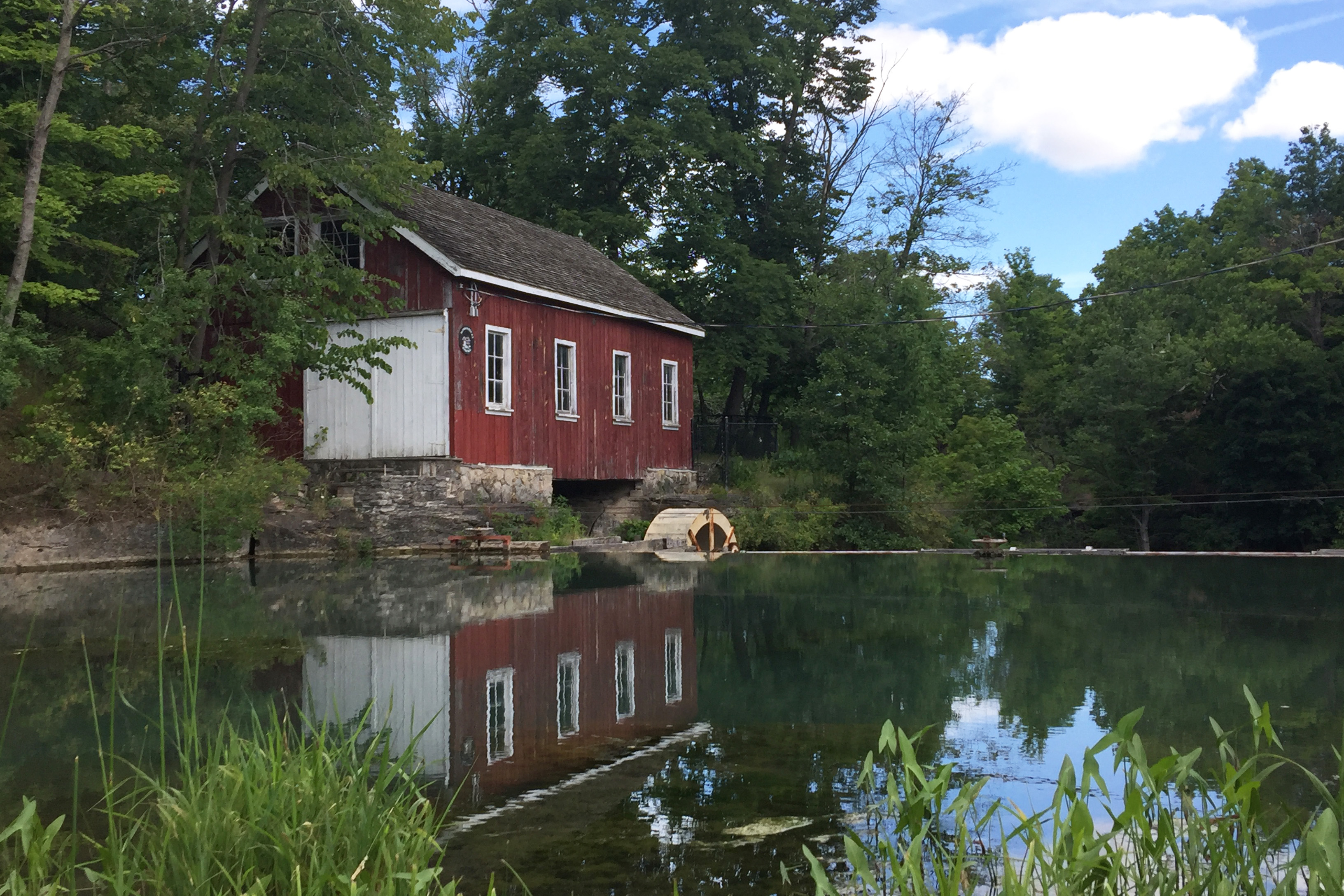 old mill in front of pond